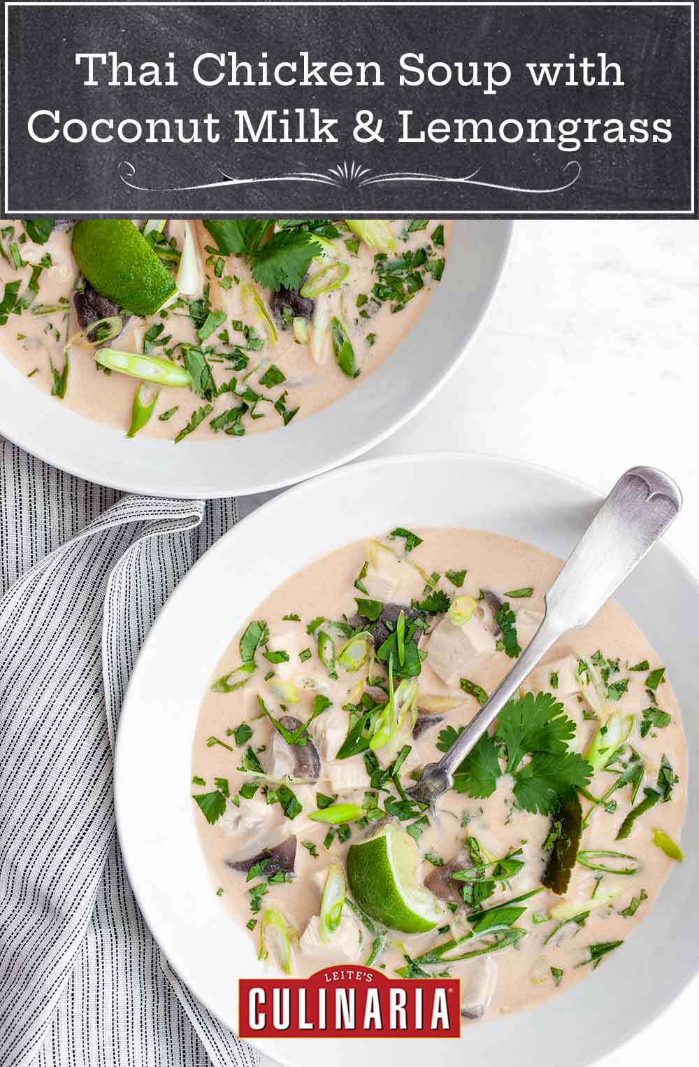 Two bowls of Thai-inspired chicken soup with coconut milk and lemongrass on a striped napkin.