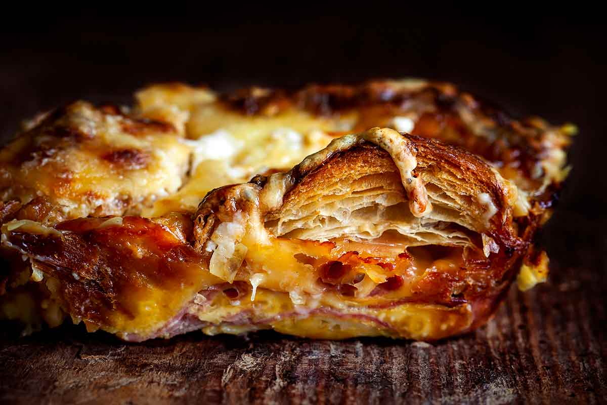 A side view of a pieces of finished croque monsieur casserole.