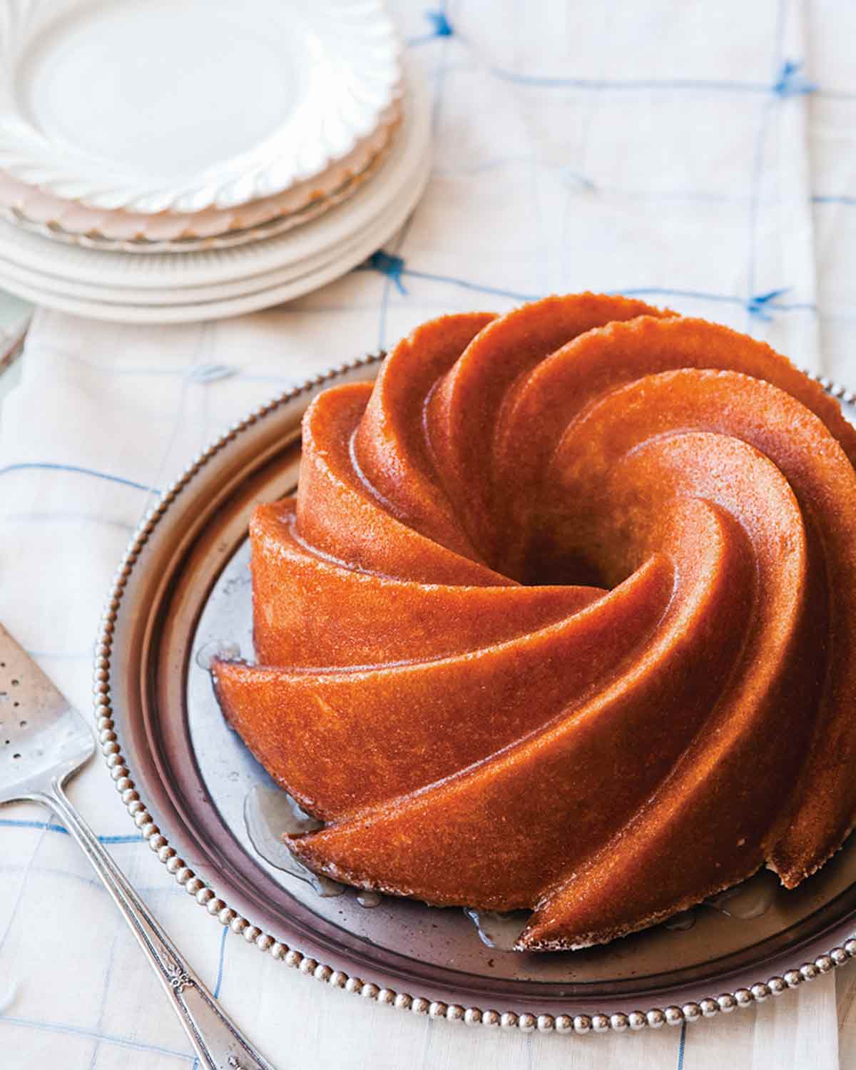 A fancy Bundt Kentucky bourbon cake on a silver platter.