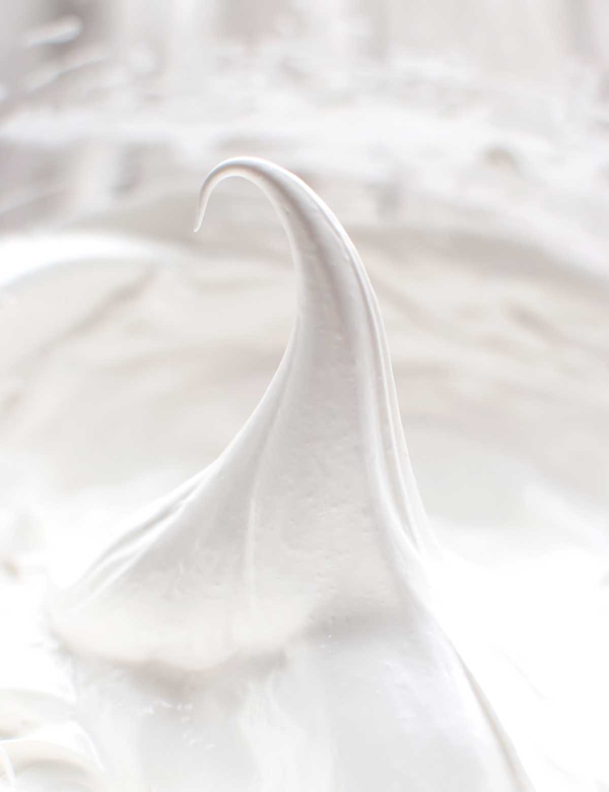 Whipped meringue, as illustration of the difference between French, Italian, and Swiss meringues.