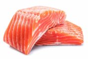Two salmon fillets stacked on top of each other as illustration for the question 'how do I remove pesky fish pin bones?'