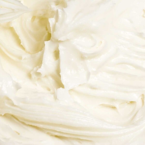 A close view of swirled cream cheese frosting.