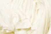 A close view of swirled cream cheese frosting.
