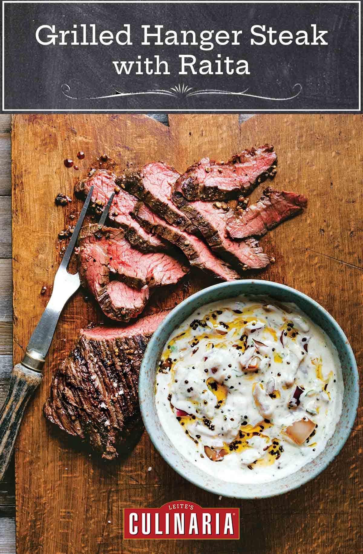 A sliced grilled hanger steak with raita in a bowl next to it on a wooden cutting board.