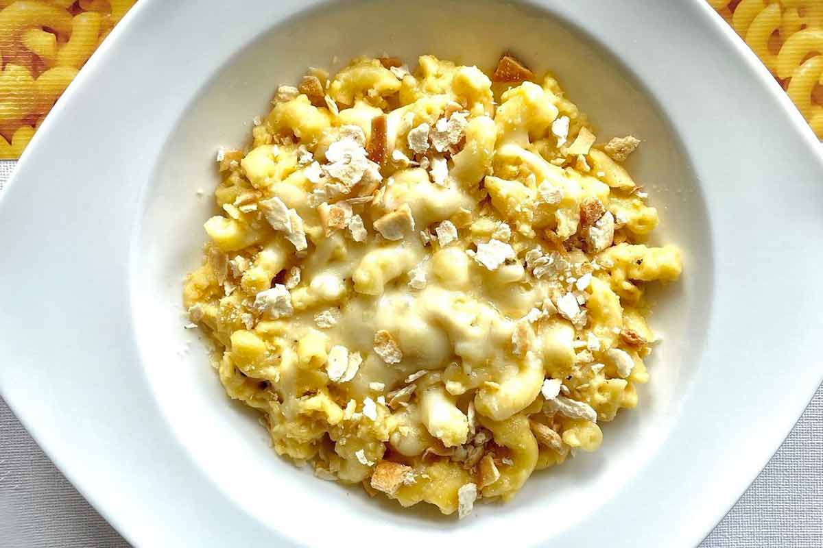A white bowl filled with stovetop mac and cheese.