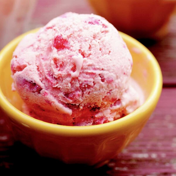 Three bowls of strawberry ice cream.