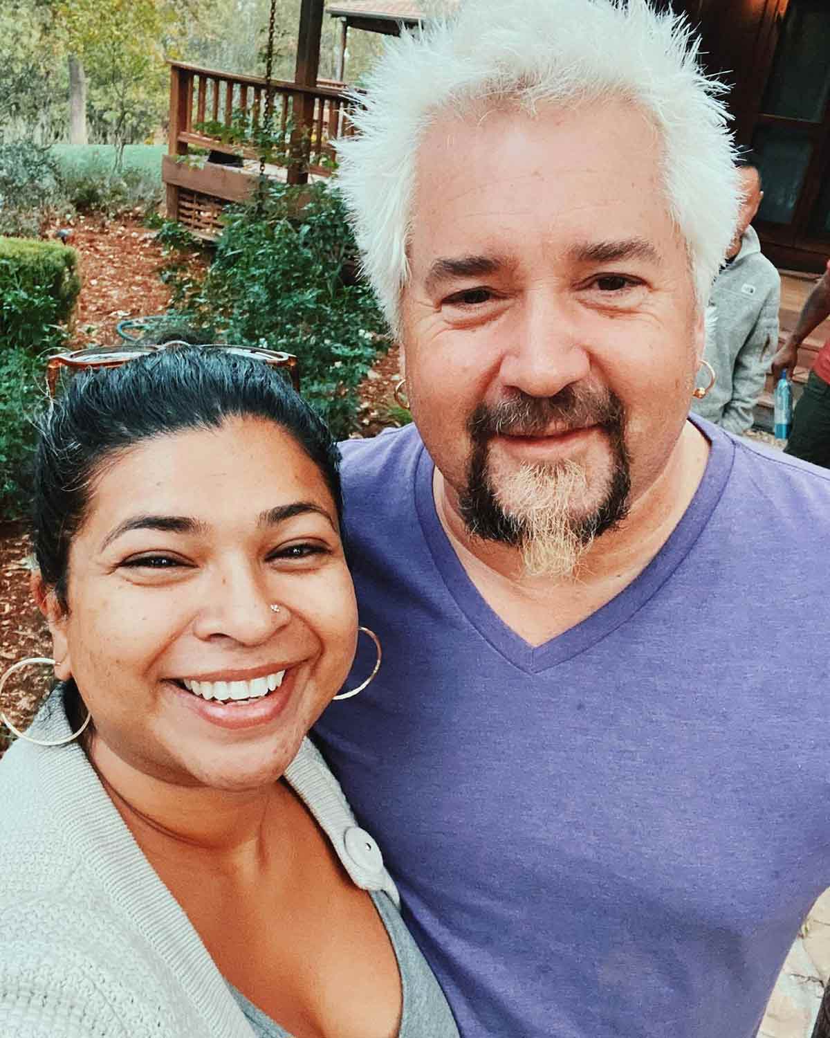 A photograph of Aarti Sequeira and Guy Fieri.