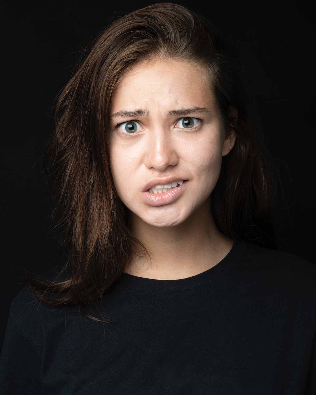 A photo of a girl looking confused.