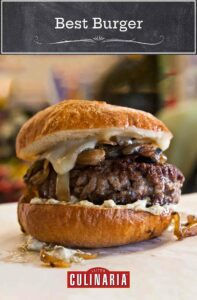 A best burger tucked inside a burger bun, topped with mushrooms, cheese, and caramelized onion.