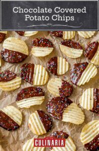 Chocolate covered potato chips with sprinkles on the chocolate in a single layer on a parchment-lined baking sheet.