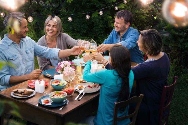 A group of people enjoying garden-to-table entertaining.