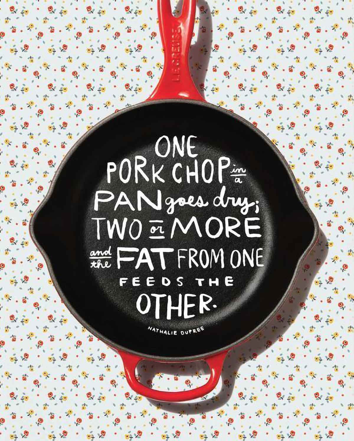 A quote about pork chops written inside a cast iron skillet.
