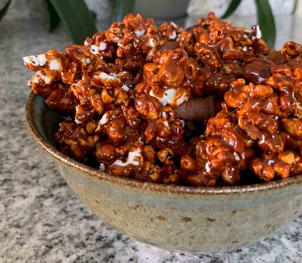 A bowl filled with spicy bacon caramel corn.
