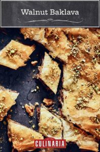 Diamond-shaped pieces of walnut baklava, topped with chopped pistachios.