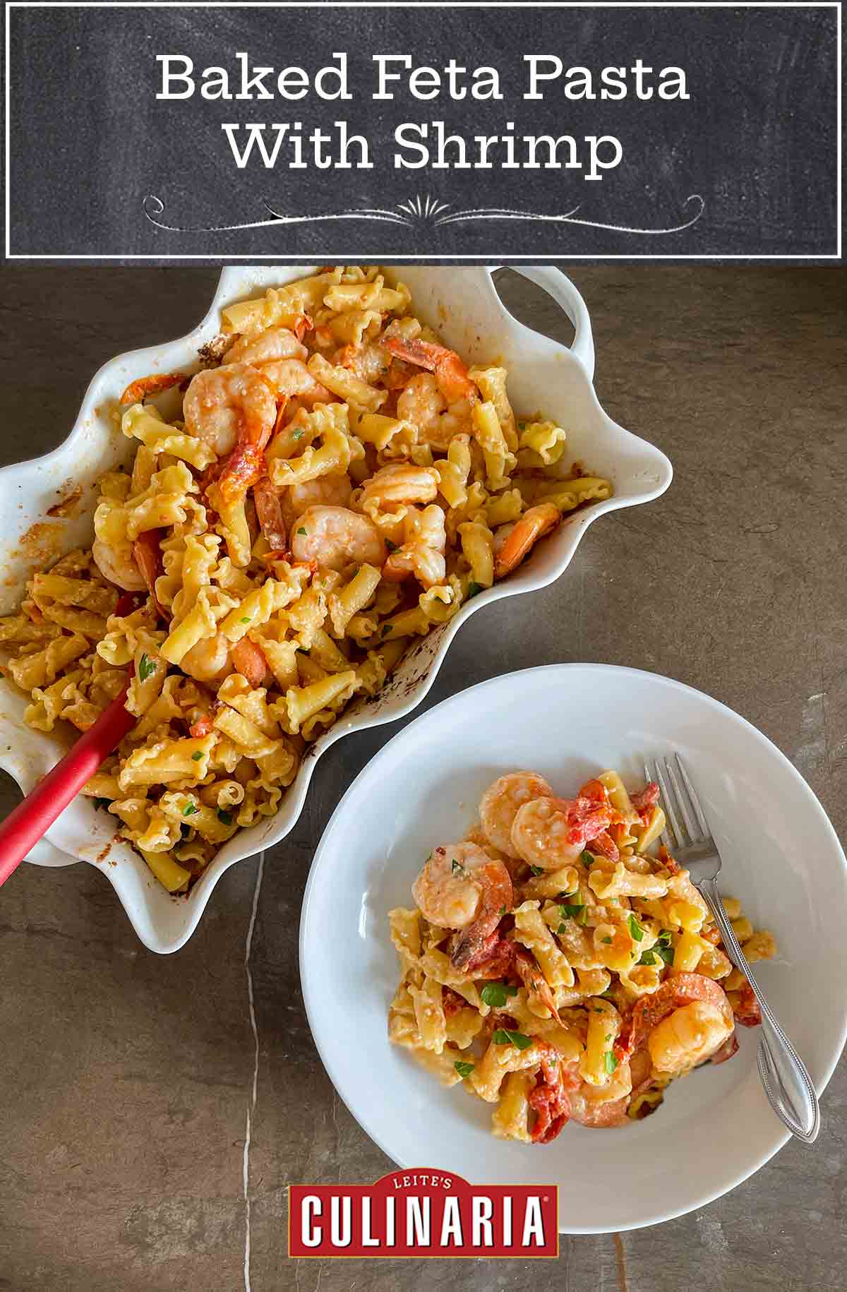 A serving dish and bowl both filled with baked pasta with shrimp, feta, and tomatoes, with a fork on the side.