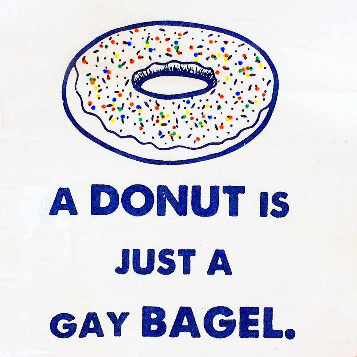 A weekend guest's hostess gift: a dish towel that reads, "A Donut is Just a Gay Bagel"