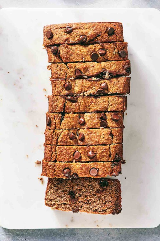 A loaf of gluten-free chocolate chip banana bread cut in to 10 slices.