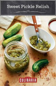 A jar and bowl of sweet pickle relish with three cucumbers lying beside them.