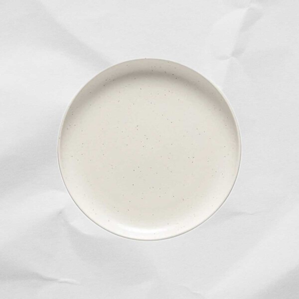 White Pacifica Salad Plate photographed on a gray background.