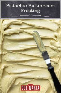 A large amount of pistachio buttercream frosting, swirled with a knife laying across it.