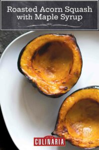2 halves of an acorn squash on a white plate, scooped out and lightly charred.