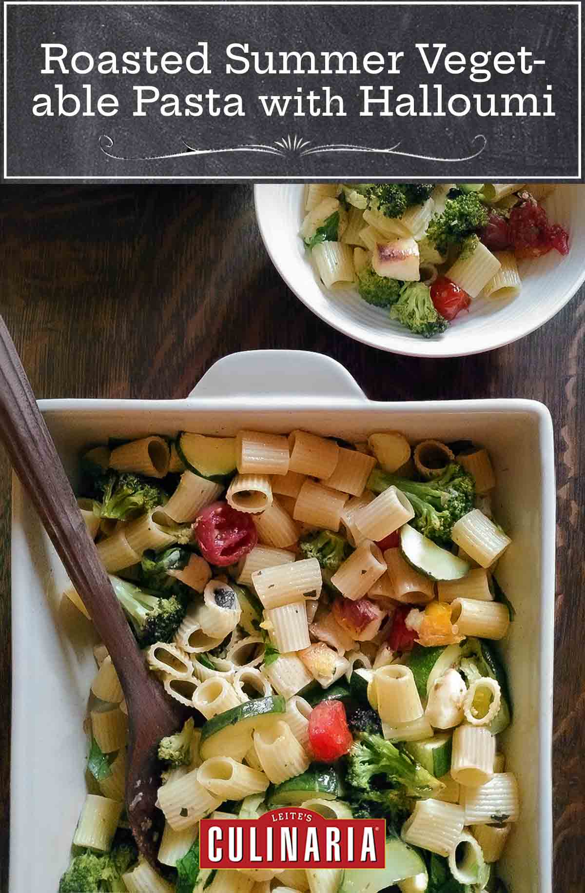A white baking dish filled with small pasta, chopped broccoli, red peppers, zucchini, and chunks of halloumi cheese, beside a white bowl containing the same.