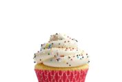 A classic vanilla cupcake with cream cheese frosting with rainbow sprinkles, in a pink cupcake paper.