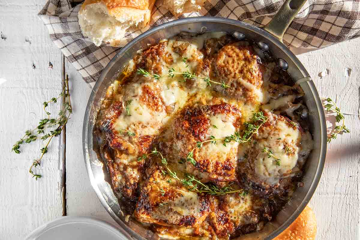 French onion skillet chicken in a copper frying pan