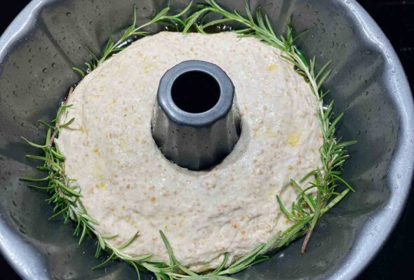 a Bundt pan with rosemary-garlic sourdough dough