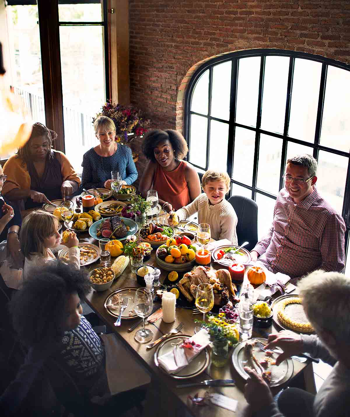 People gathered around a Thanksgiving table