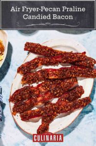 Seven strips of air fryer pecan praline candied bacon in a white plate