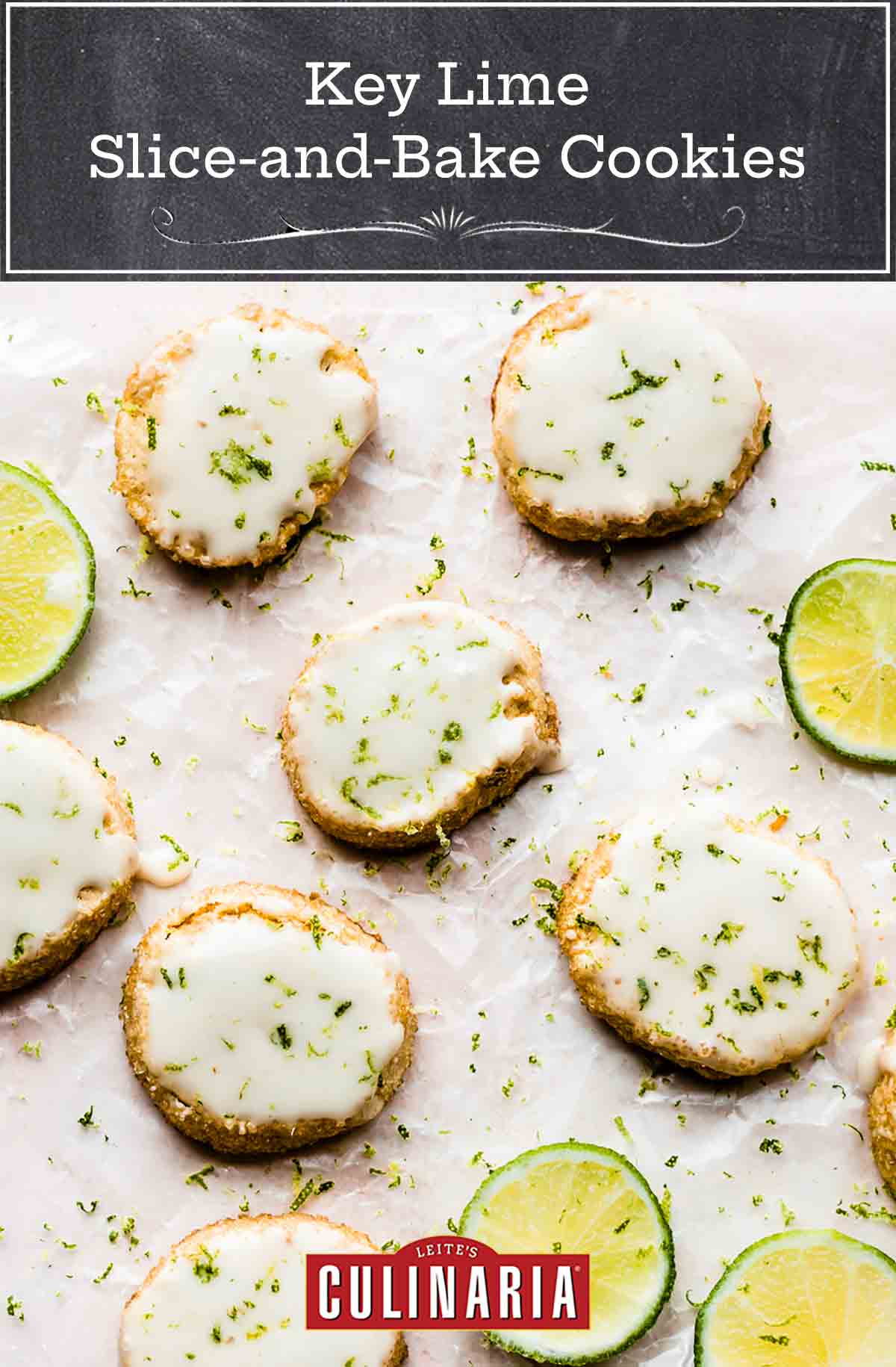 Key lime slice and bake cookies garnished with lime zest beside slices of lime, all on a sheet of parchment paper.