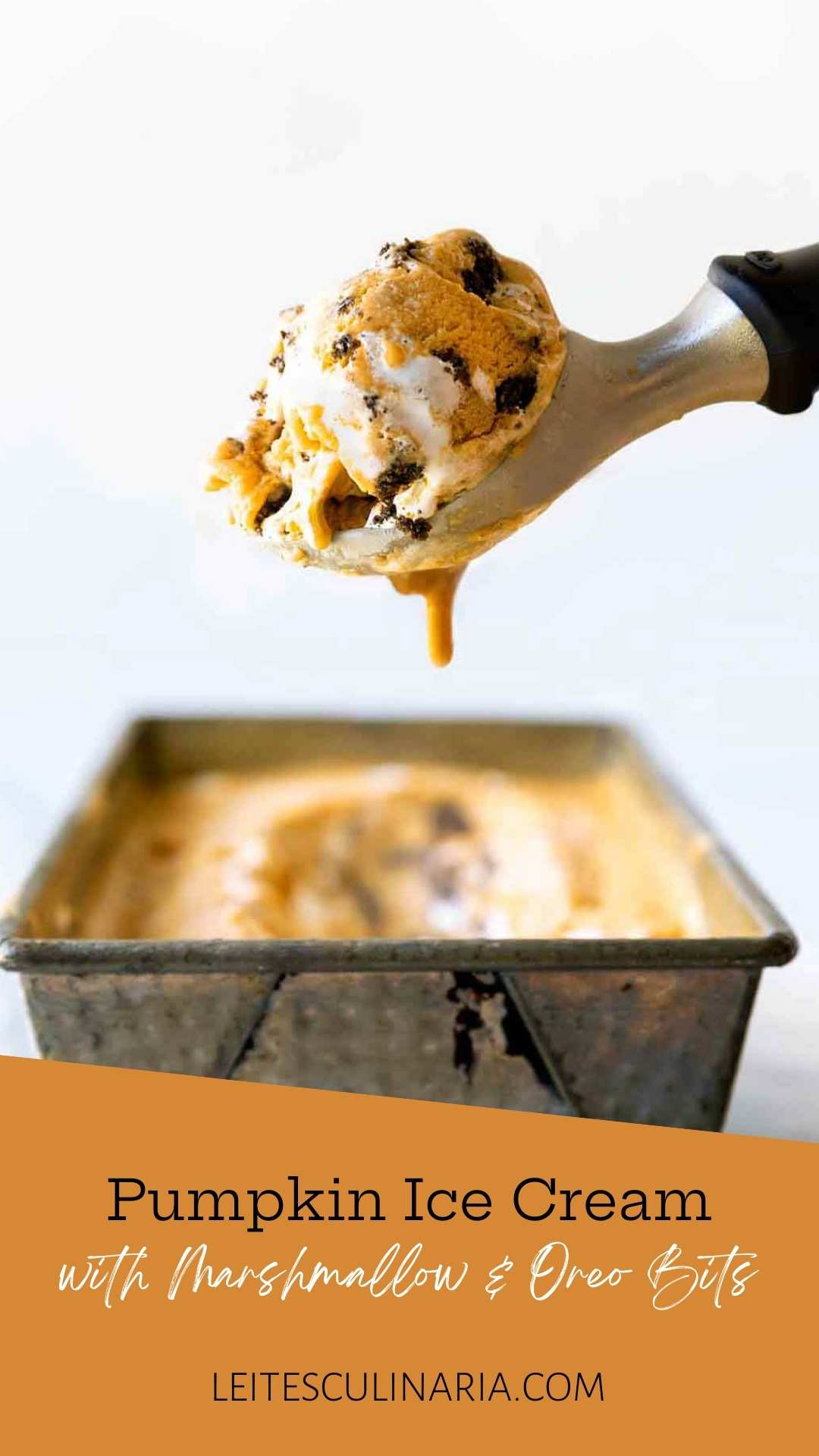 A container of Pumpkin Meringue Pie Ice Cream with a scoop.