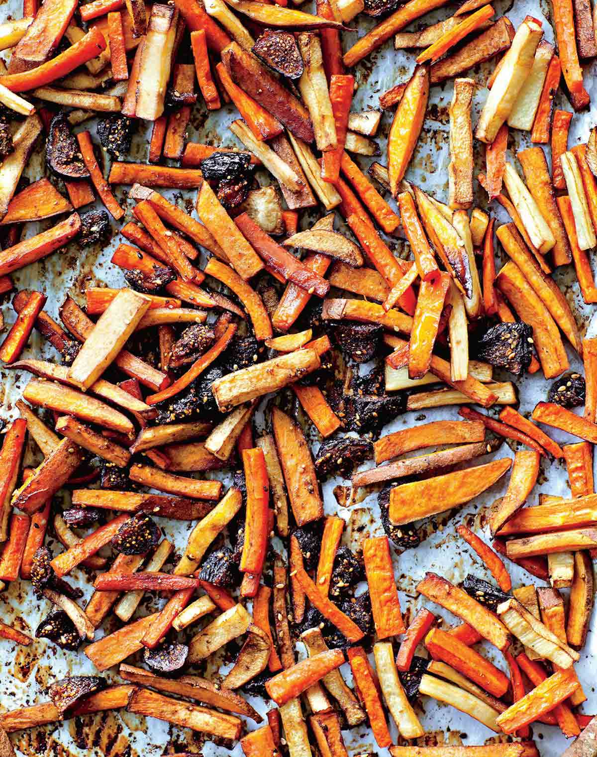 Roasted tzimmes on a large sheet pan.