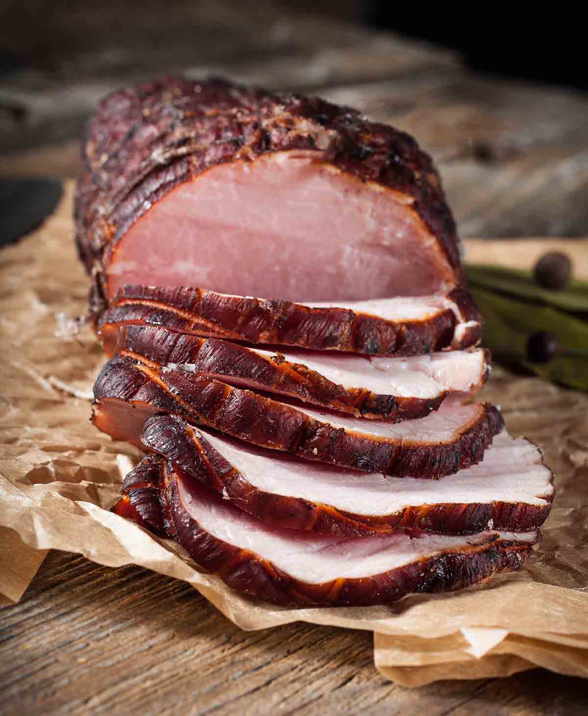 Smoked Ham sliced on butcher's paper.