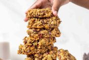 A woman's hand piling up superfood breakfast cookies