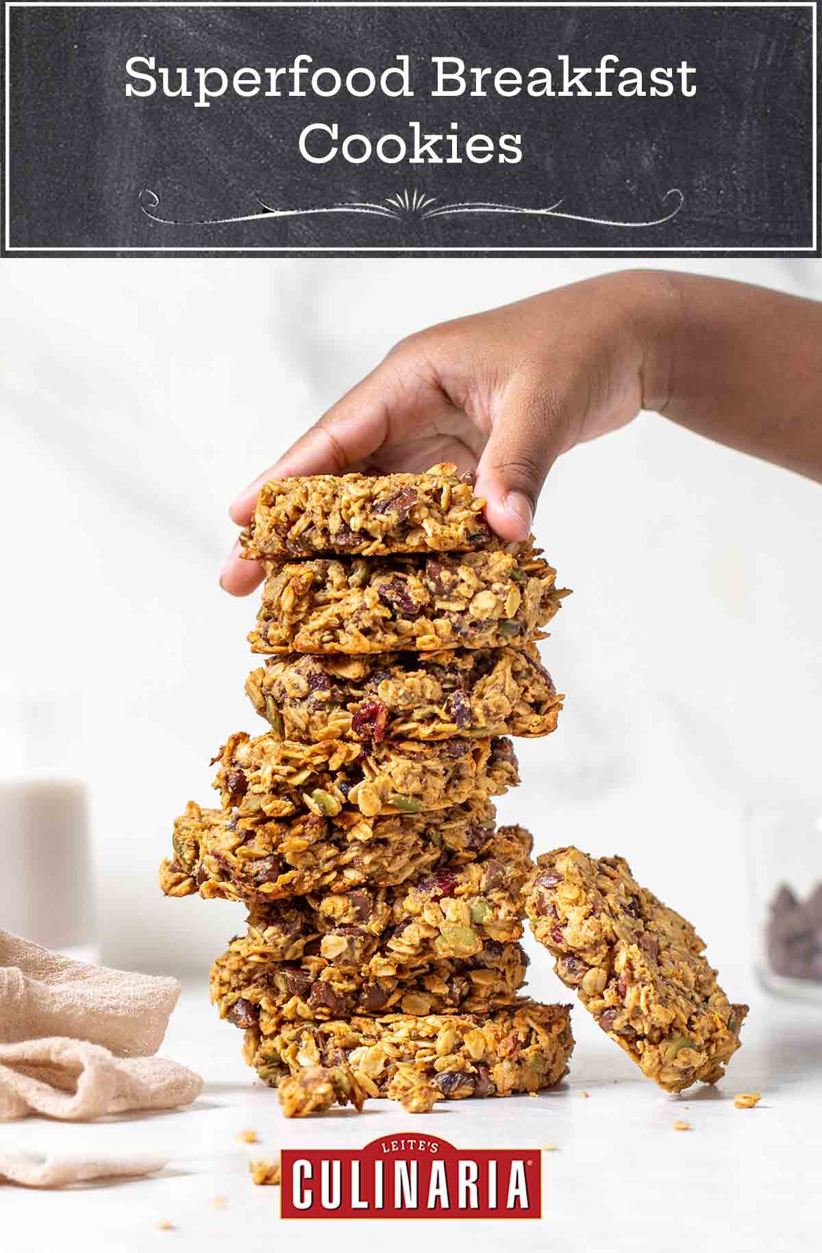 A woman's hand piling up superfood breakfast cookies