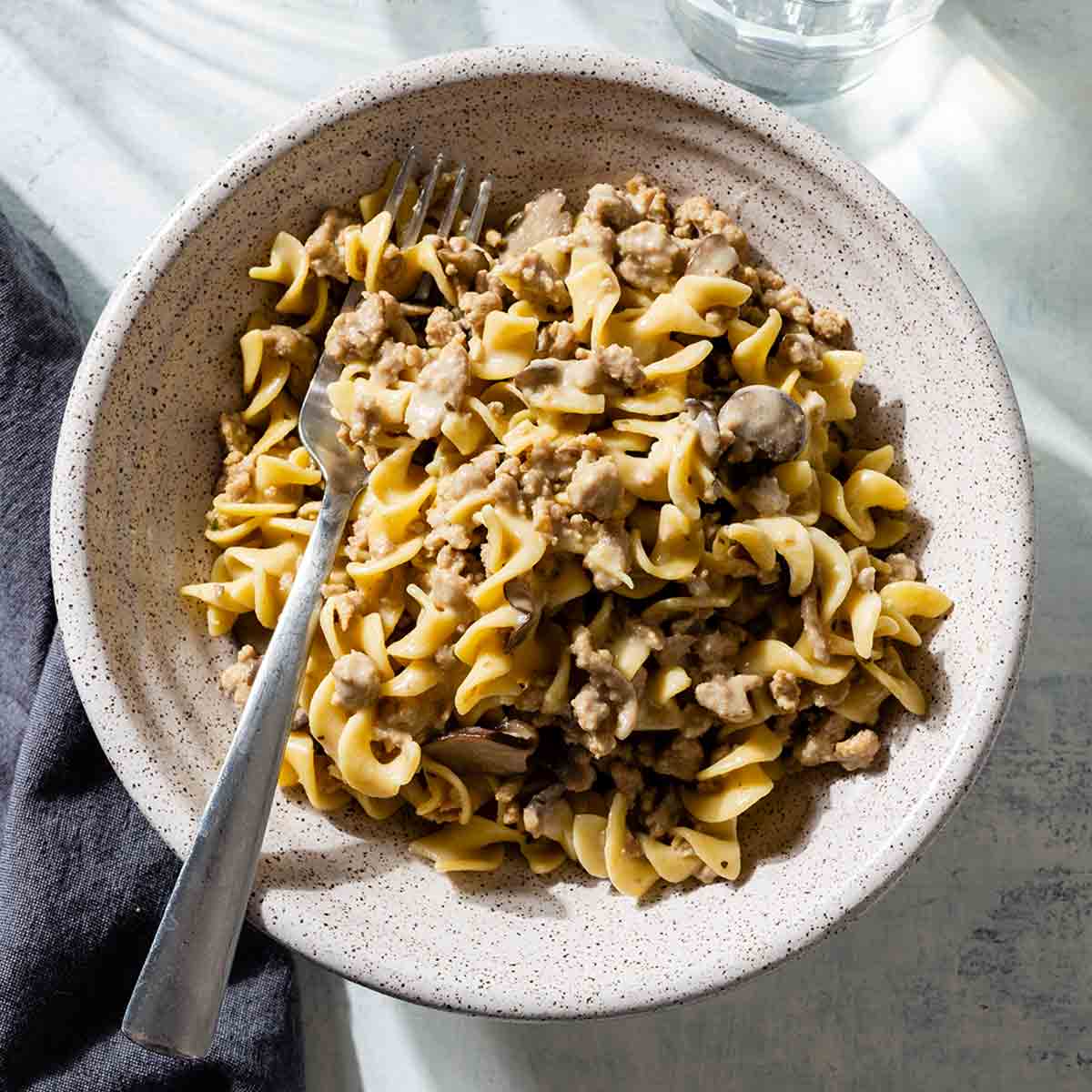 A bowl of creamy pork and egg noodles