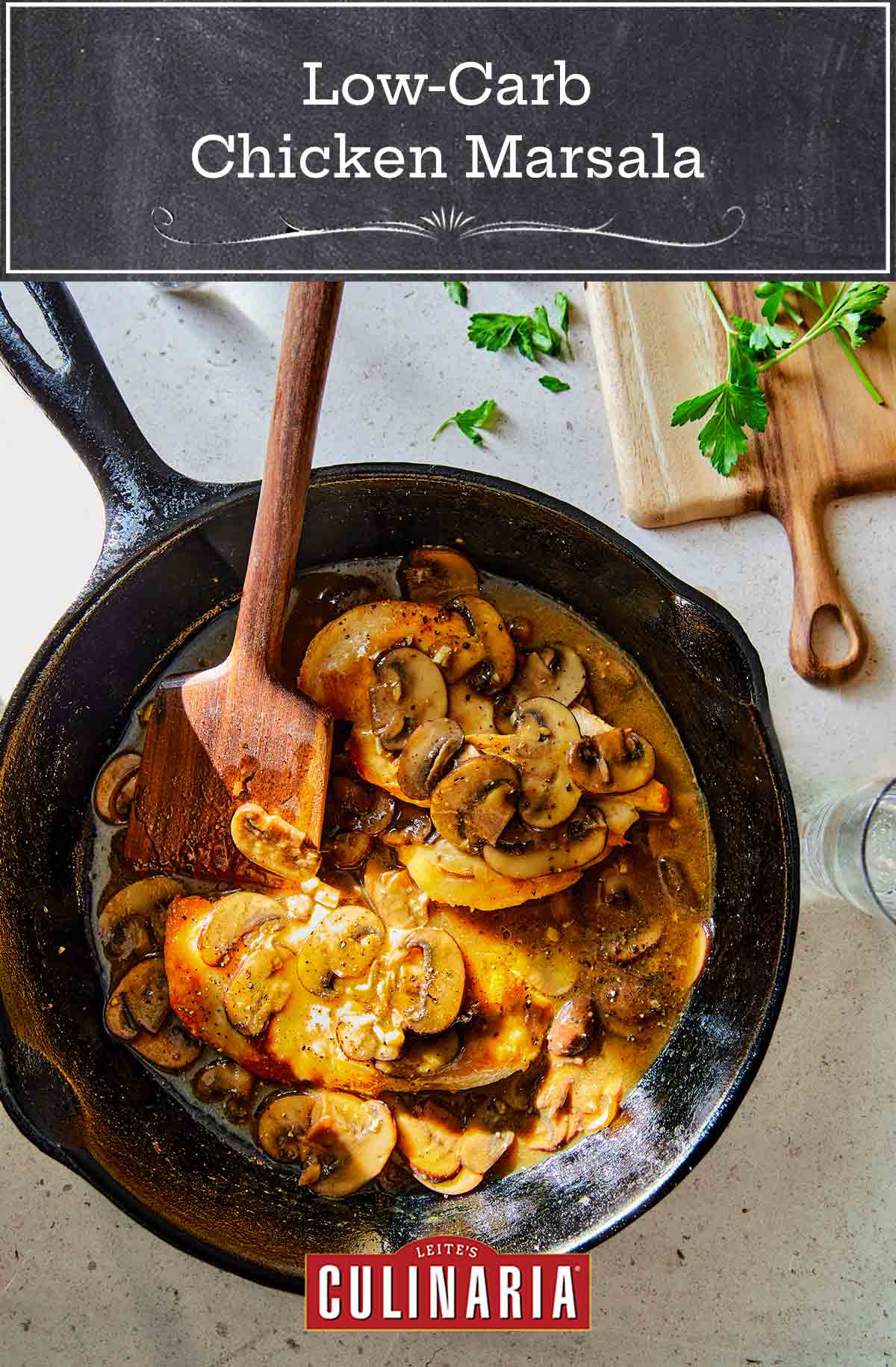 A cast-iron skillet with low-carb chicken Marsala on a counter