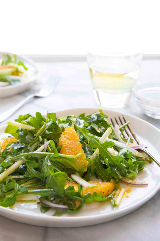 Two plates of apple, fennel, and orange salad