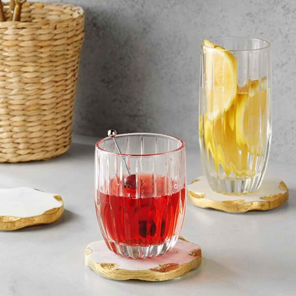 Godinger Gold Edge Marble Coasters with lemons on right and cherry drink in middle.