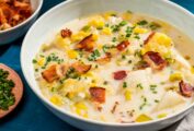 Two bowls of Instant Pot New England fish chowder on a blue background