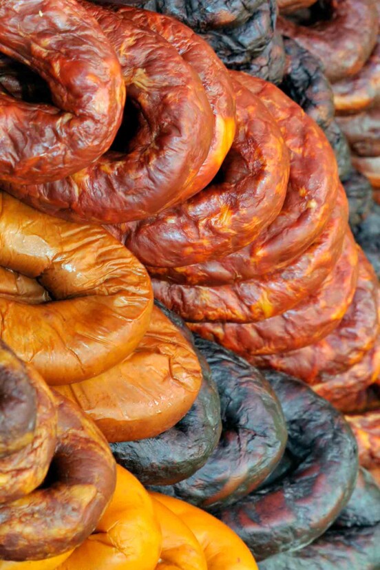 Rows of different Portuguese sausages