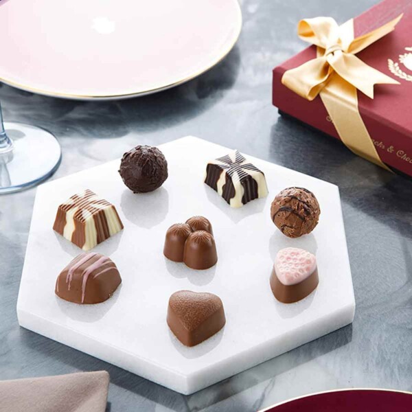 Carian’s Bistro Belgian Chocolate Gift Box on marble board.
