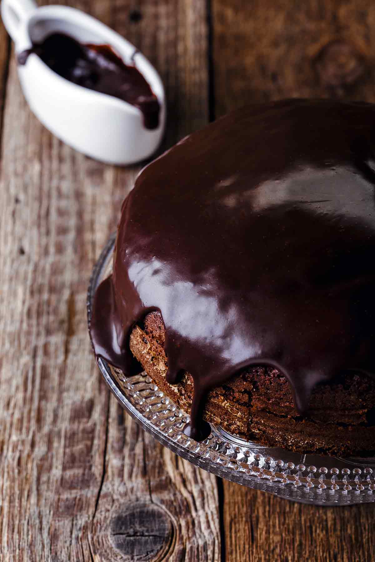 A chocolate mocha cake with chocolate Irish whiskey glaze being poured on top