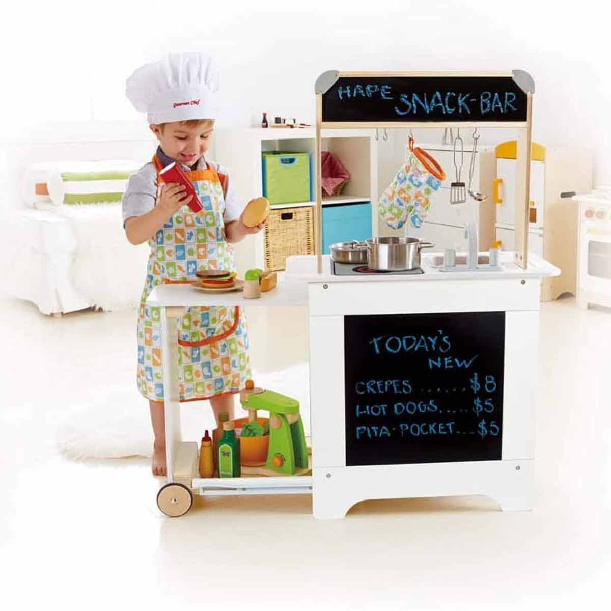 Hape Playfully Delicious Wooden Play Kitchen with child chef.