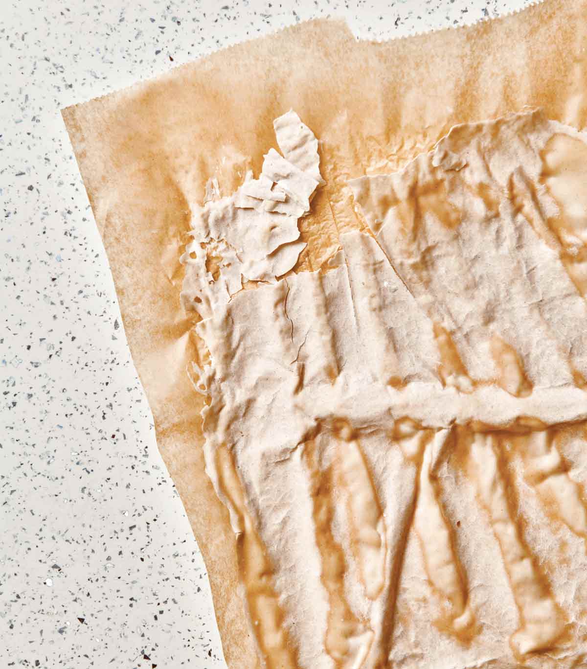 Dried sourdough on a sheet of parchment