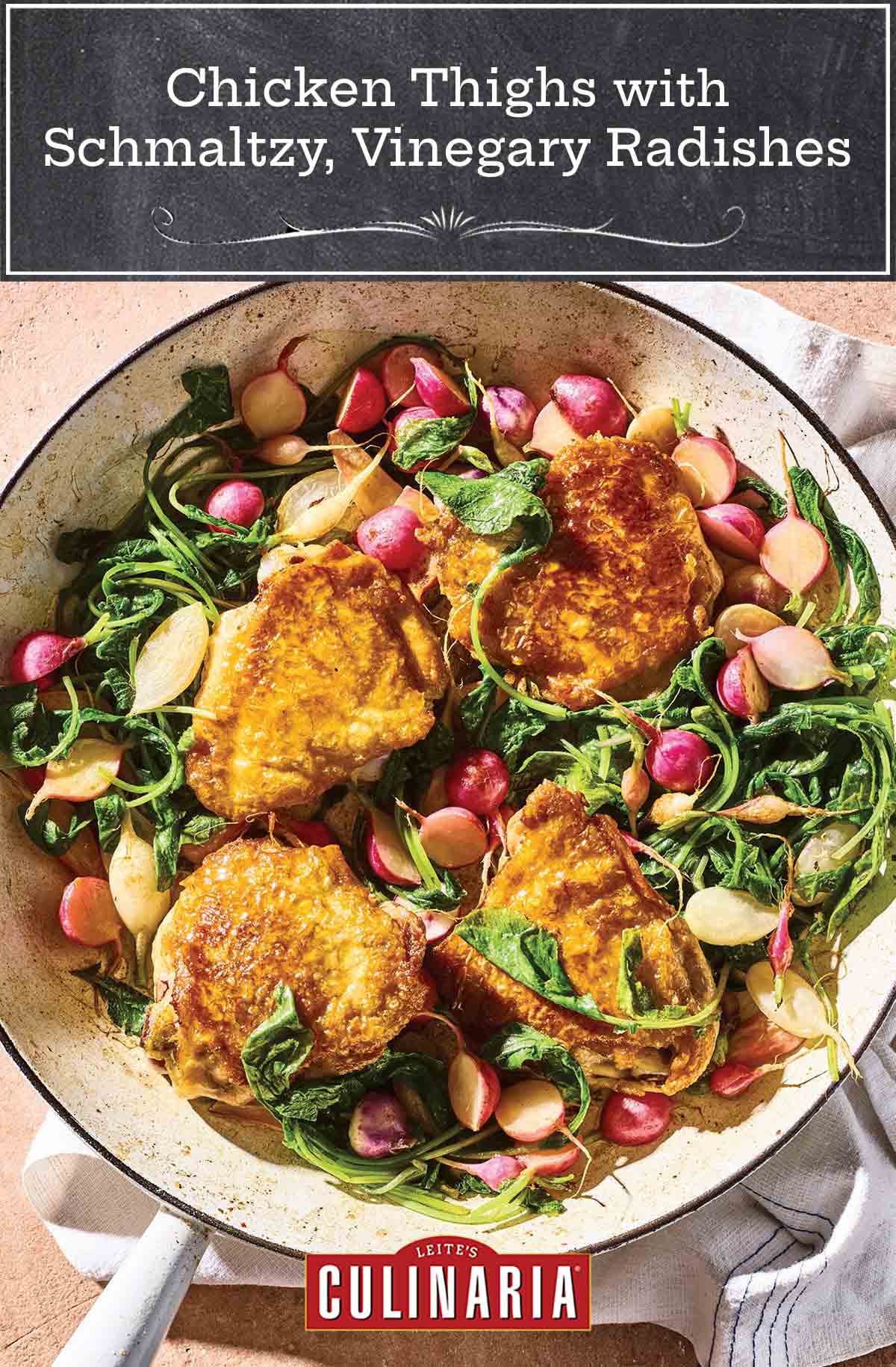 A white enameled skillet filled with chicken thighs, halved radishes, and radish greens