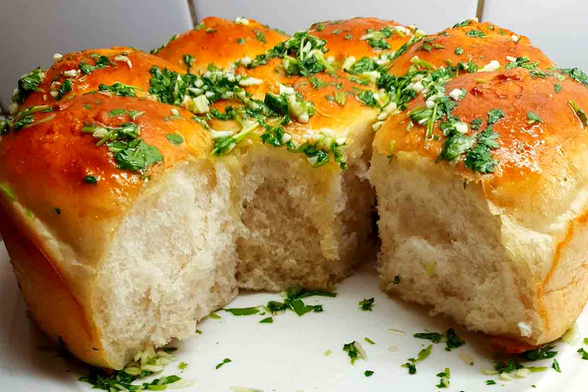 Ukrainian garlic bread rolls covered with garlic and parsley