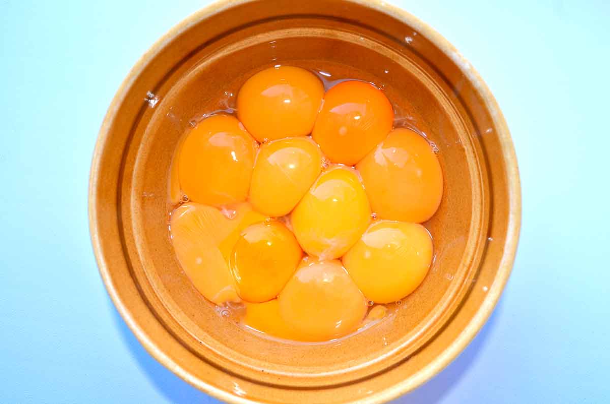 A bowl of yolks that range in color from deep orange to pale yellow